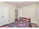 A bedroom with wood-look floors features a bed, window and closet at 208 Lakewood Ave, Charlotte, NC 28208