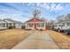 Charming single-story home with a red roof, siding, and landscaped front yard at 208 Lakewood Ave, Charlotte, NC 28208