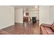 Open-concept living room flows into the dining area and features wood floors and neutral paint at 208 Lakewood Ave, Charlotte, NC 28208