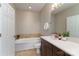 Bathroom with soaking tub and vanity at 211 Harbour Place Dr, Davidson, NC 28036