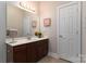 Bathroom with vanity, mirror, and a door at 211 Harbour Place Dr, Davidson, NC 28036