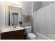 Clean bathroom with tub shower, toilet and vanity at 211 Harbour Place Dr, Davidson, NC 28036