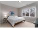 Bright bedroom with a king-size bed and large window at 211 Harbour Place Dr, Davidson, NC 28036