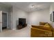 Bright bonus room with TV, couch and access to another room at 211 Harbour Place Dr, Davidson, NC 28036