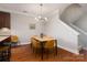 Dining area with wood floors and modern light fixture at 211 Harbour Place Dr, Davidson, NC 28036