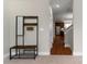 Entryway with coat rack and bench, view of kitchen and stairs at 211 Harbour Place Dr, Davidson, NC 28036