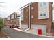 Rear view showcasing the building's exterior and garage access at 211 Harbour Place Dr, Davidson, NC 28036