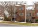 Brick three-story townhome with front entrance and landscaping at 211 Harbour Place Dr, Davidson, NC 28036