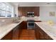 Modern kitchen with granite countertops and stainless steel appliances at 211 Harbour Place Dr, Davidson, NC 28036