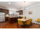 Kitchen with island, stainless steel appliances, and hardwood floors at 211 Harbour Place Dr, Davidson, NC 28036