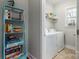 Laundry room with washer, dryer, and shelving unit at 211 Harbour Place Dr, Davidson, NC 28036