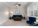 Living room featuring a blue sofa and large window at 211 Harbour Place Dr, Davidson, NC 28036