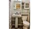 Clean bathroom with pedestal sink, toilet and storage cabinet at 235 Linda St, Salisbury, NC 28146