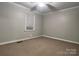 Simple bedroom with carpeted floor and window with blinds at 235 Linda St, Salisbury, NC 28146