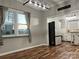 Dining room with hardwood floors and view into kitchen at 235 Linda St, Salisbury, NC 28146