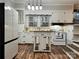 White kitchen with updated cabinets and stylish light fixture at 235 Linda St, Salisbury, NC 28146