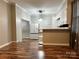 Kitchen with white cabinets, hardwood floors, and island at 235 Linda St, Salisbury, NC 28146