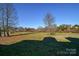 Spacious backyard with mature trees and open space at 2610 Lucy Short Cut Rd, Marshville, NC 28103