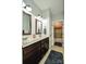 Double vanity bathroom with dark brown cabinets and a view of another bathroom at 2610 Lucy Short Cut Rd, Marshville, NC 28103