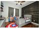 bedroom with wood-paneled accent wall and hardwood floor at 2610 Lucy Short Cut Rd, Marshville, NC 28103