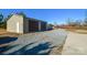 Tan metal detached garage with two roll-up doors at 2610 Lucy Short Cut Rd, Marshville, NC 28103