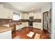 Spacious kitchen featuring granite countertops, stainless steel appliances, and hardwood floors at 2610 Lucy Short Cut Rd, Marshville, NC 28103