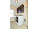 Bright laundry room with washer, dryer, and dark brown cabinets at 2610 Lucy Short Cut Rd, Marshville, NC 28103