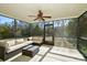 Screened porch with wicker furniture and ceiling fan at 2610 Lucy Short Cut Rd, Marshville, NC 28103