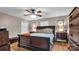 Bedroom with hardwood floors, ceiling fan, and ample closet space at 277 Archie Mountain Ln, Taylorsville, NC 28681