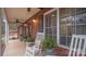 Relaxing front porch with rocking chairs, brick facade, and ceiling fan at 277 Archie Mountain Ln, Taylorsville, NC 28681