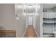 Long hallway with hardwood floors and doors to bedrooms and bath at 277 Archie Mountain Ln, Taylorsville, NC 28681