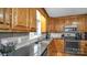 Kitchen features wood cabinets, granite counters, and stainless steel appliances at 277 Archie Mountain Ln, Taylorsville, NC 28681