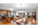 Open concept kitchen and dining area with wood cabinets and stainless steel appliances at 277 Archie Mountain Ln, Taylorsville, NC 28681