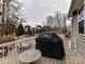 Deck with built-in grill, table and chairs, overlooks fenced backyard at 3020 Sewee Ln, Waxhaw, NC 28173