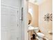 Small powder room with single sink and toilet at 3020 Sewee Ln, Waxhaw, NC 28173