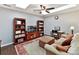 Bonus room with hardwood floors, a sofa, and built-in shelving at 3020 Sewee Ln, Waxhaw, NC 28173