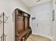 Entryway with built-in bench, shoe storage, and coat hooks at 3020 Sewee Ln, Waxhaw, NC 28173