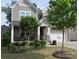 Charming two-story home featuring stone accents, a well-manicured lawn, and a welcoming front porch at 3020 Sewee Ln, Waxhaw, NC 28173