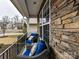 Cozy front porch with two wicker chairs and blue cushions at 3020 Sewee Ln, Waxhaw, NC 28173