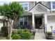 Cozy front porch with comfortable seating and a beautifully landscaped garden area at 3020 Sewee Ln, Waxhaw, NC 28173