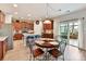 Bright kitchen and breakfast nook features stainless appliances, wood cabinets and seating for four at 3020 Sewee Ln, Waxhaw, NC 28173