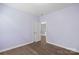 Pastel bedroom with wood floors and a view of another room at 3126 Elmwood Dr, Monroe, NC 28110