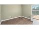 Small bedroom with light walls and wood floors at 3126 Elmwood Dr, Monroe, NC 28110