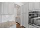 Kitchen with gray cabinets, granite countertops, and white backsplash at 3126 Elmwood Dr, Monroe, NC 28110