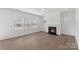 Bright living room with a fireplace and hardwood floors at 3126 Elmwood Dr, Monroe, NC 28110