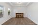 Living room with hardwood floors and a stone fireplace at 3126 Elmwood Dr, Monroe, NC 28110