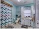 Guest bathroom with white vanity and chevron shower curtain at 4105 South Fork Ave, Hickory, NC 28602