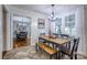 Farmhouse style dining area with a wooden table and bench at 4105 South Fork Ave, Hickory, NC 28602