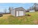 Detached garage with white roll-up door and side access at 4105 South Fork Ave, Hickory, NC 28602