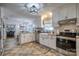 Kitchen with white cabinets, granite counters, and farm sink at 4105 South Fork Ave, Hickory, NC 28602